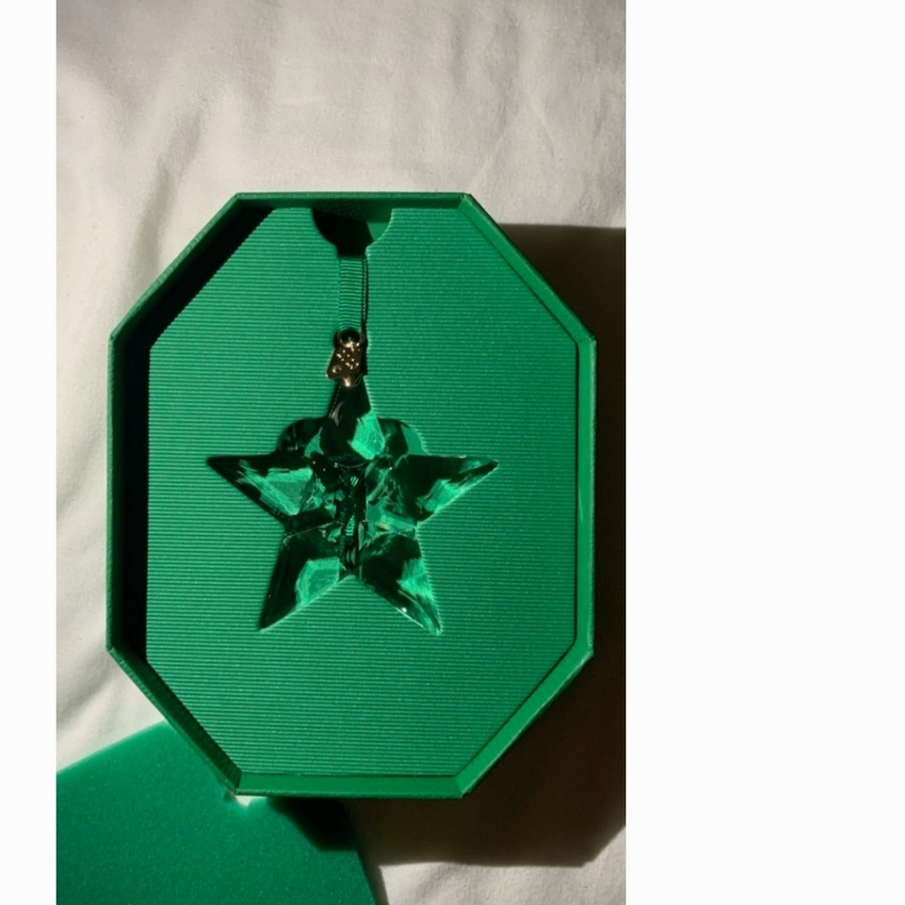 Annual Swarovski 2023 holiday ornament. Never used in its original box.